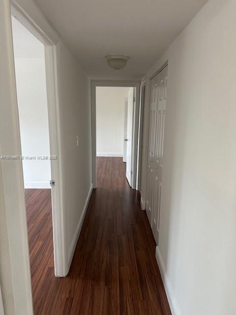5400 Southwest 77th Court, Unit 2R Miami, FL 33155 - Photo 12 of 18 a view of a hallway with wooden floor