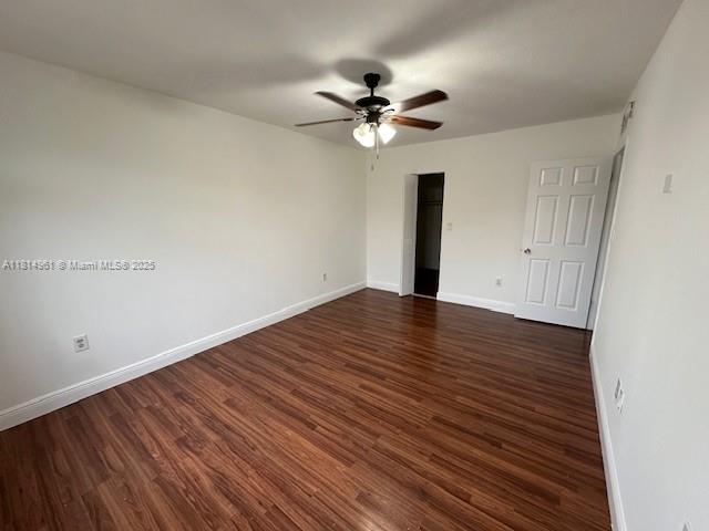 5400 Southwest 77th Court, Unit 2R Miami, FL 33155 - Photo 14 of 18 a view of a room with wooden floor and a ceiling fan