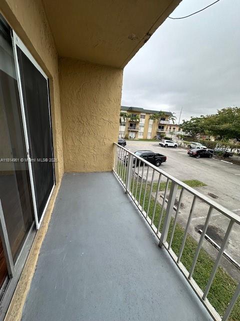 5400 Southwest 77th Court, Unit 2R Miami, FL 33155 - Photo 16 of 18 a view of a balcony with an ocean view
