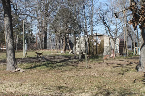 a backyard of apartments with trees