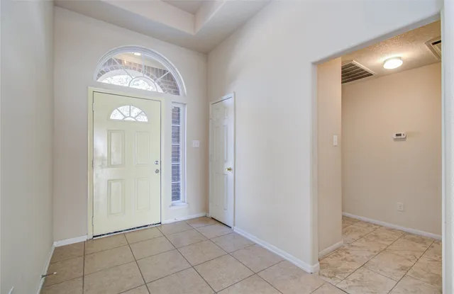 a view of an entryway and a hallway