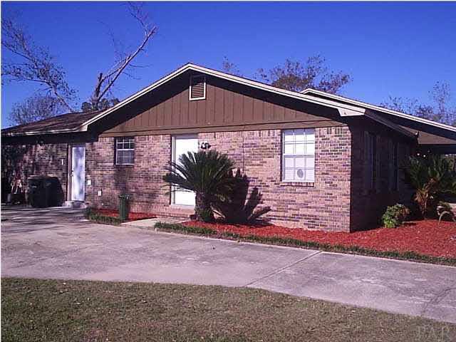 4391 Stephens Road Pace, FL 32571 - Photo 2 of 11 a view of a house with backyard and porch