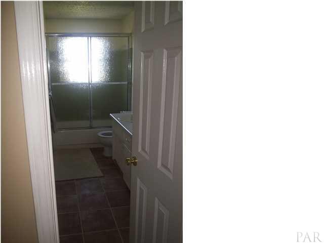 4391 Stephens Road Pace, FL 32571 - Photo 4 of 11 a bathroom with a toilet