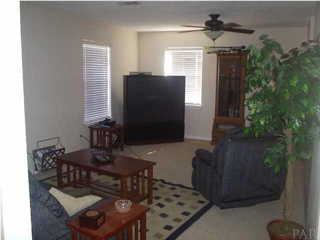 4391 Stephens Road Pace, FL 32571 - Photo 7 of 11 a living room with furniture and a potted plant