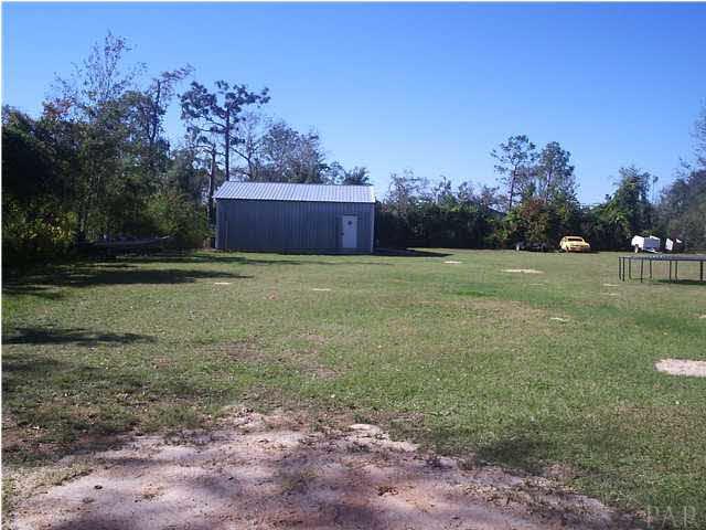 4391 Stephens Road Pace, FL 32571 - Photo 10 of 11 a view of outdoor space with deck and yard