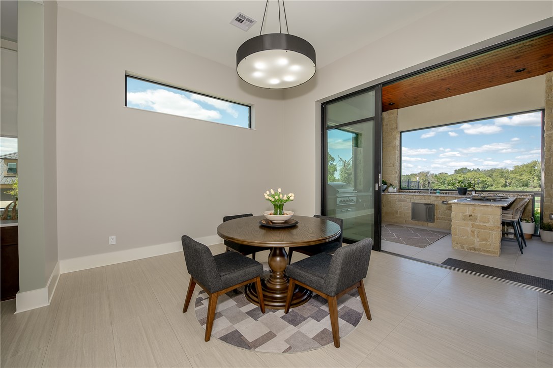 3320 Sycamore Trail Bryan, TX 77807 - Photo 10 of 48 Dining space featuring plenty of natural light, baseboards, and visible vents