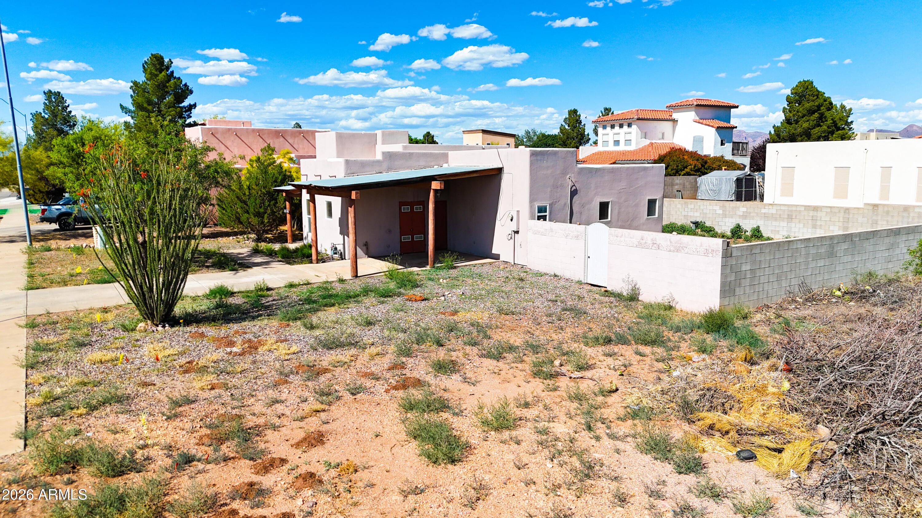 4105 North Washington Avenue Douglas, AZ 85607 - Photo 24 of 61 a front view of a house with a yard and garage