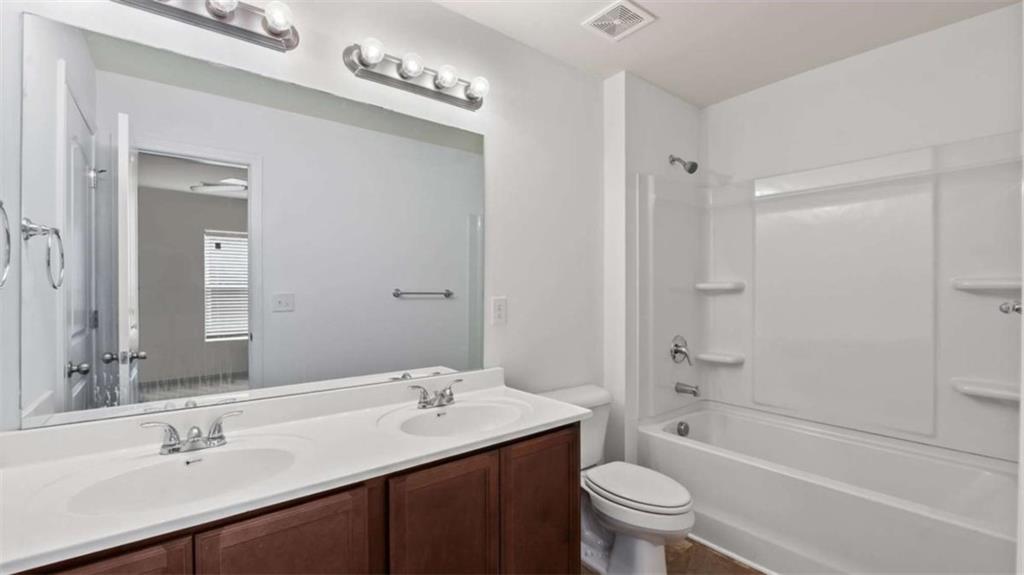 31 Southfork Drive Rome, GA 30165 - Photo 19 of 24 a bathroom with a sink a toilet and shower