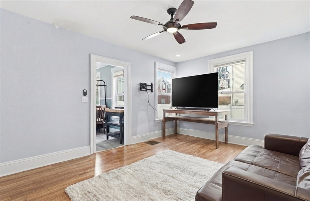 163-165 Chestnut Street Waltham, MA 02453 - Photo 20 of 41 a living room with furniture and a flat screen tv