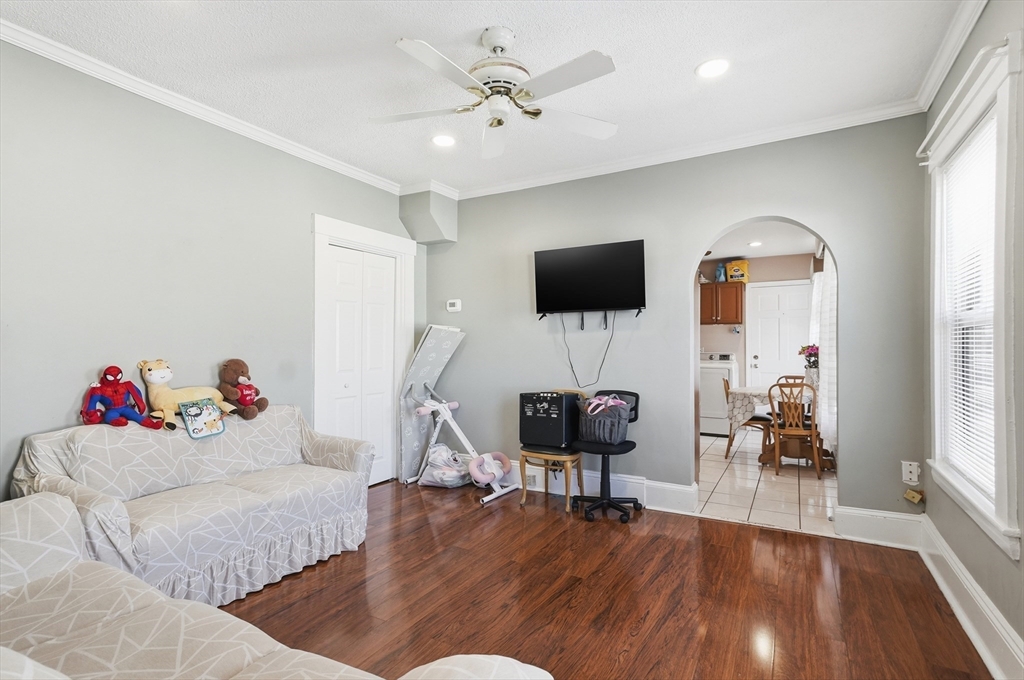 163-165 Chestnut Street Waltham, MA 02453 - Photo 26 of 41 a living room with furniture and a flat screen tv