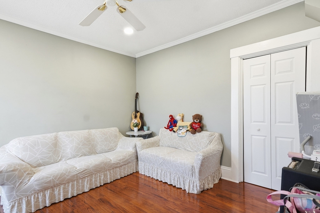 163-165 Chestnut Street Waltham, MA 02453 - Photo 27 of 41 a living room with furniture and a flat screen tv