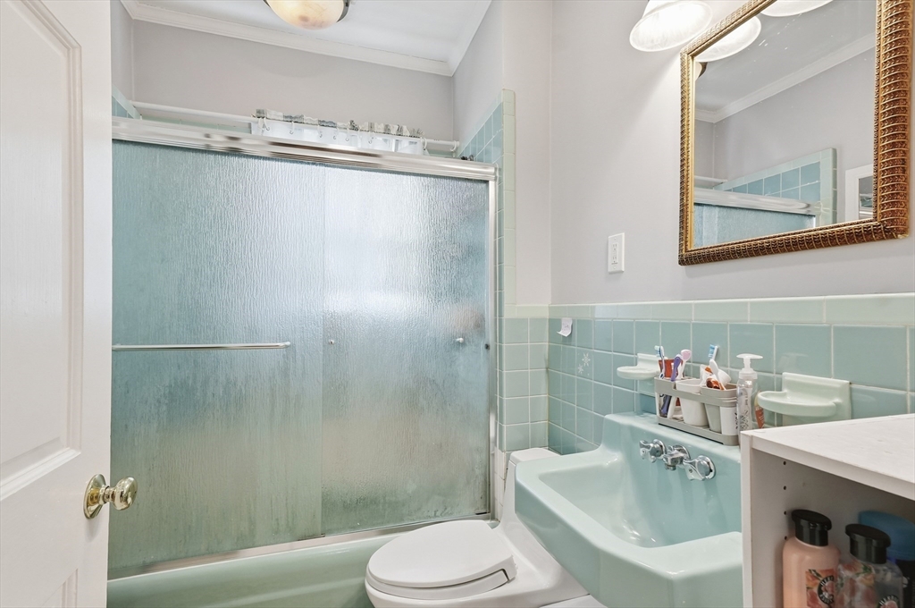 163-165 Chestnut Street Waltham, MA 02453 - Photo 36 of 41 a bathroom with a sink toilet and shower