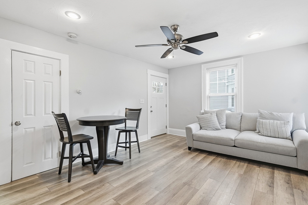 163-165 Chestnut Street Waltham, MA 02453 - Photo 4 of 41 a living room with furniture and a wooden floor