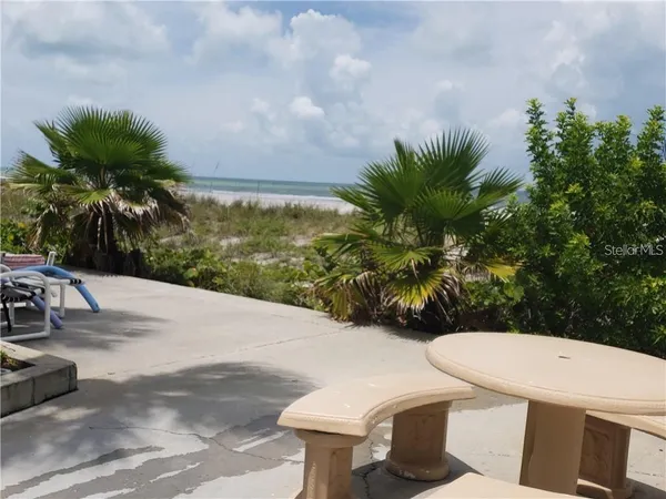 a view of a terrace with chairs