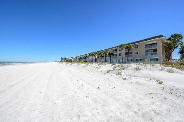 a view of a yard covered in snow