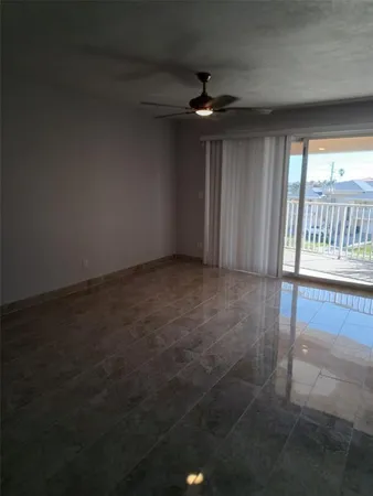 an empty room with windows and yard