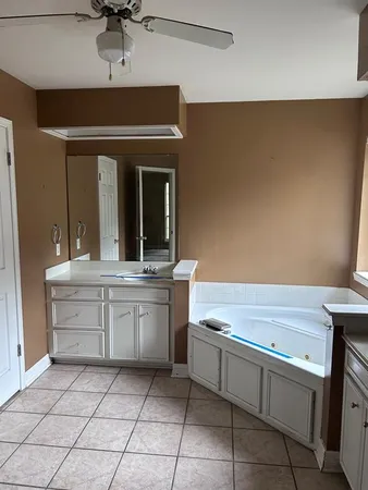 a kitchen with a sink and cabinets