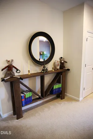 a room with a washing machine and a mirror