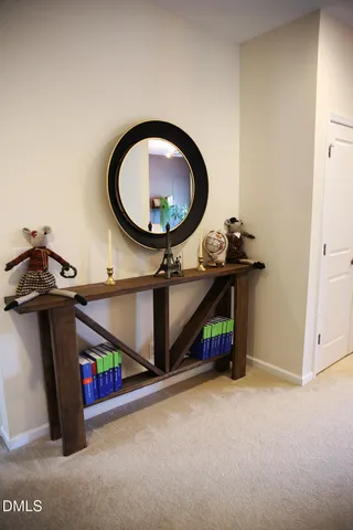 a room with a washing machine and a mirror