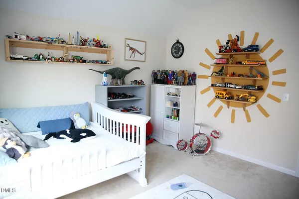 a bedroom with a bed and cabinets