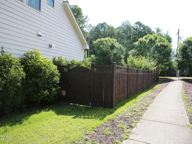 a backyard of a house with lots of green space