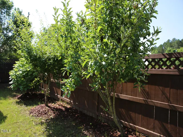 a view of yard from deck with outdoor seating