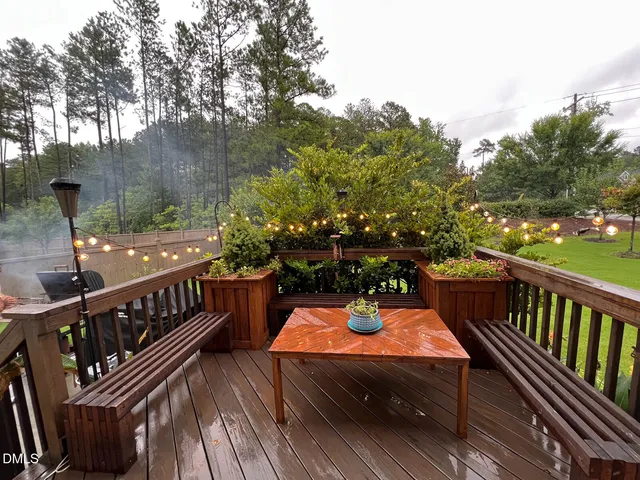 a view of a balcony with two chairs and a table