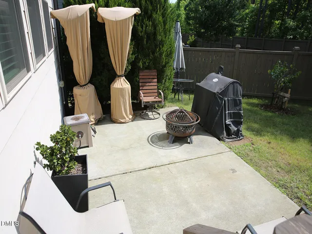 a view of potted plants and a fountain in the patio