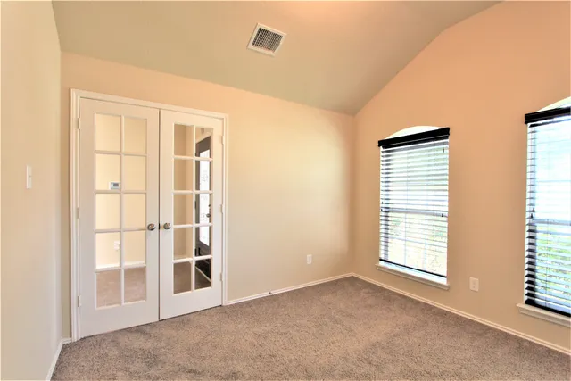 an empty room with windows