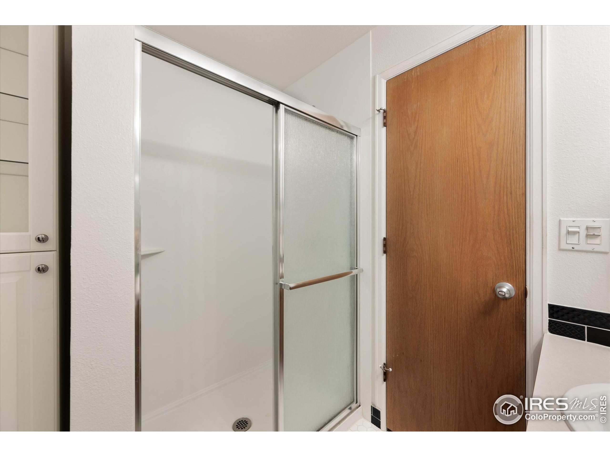2960 West Stuart Street, Unit 304 Fort Collins, CO 80526 - Photo 17 of 28 a bathroom with a shower and a sink