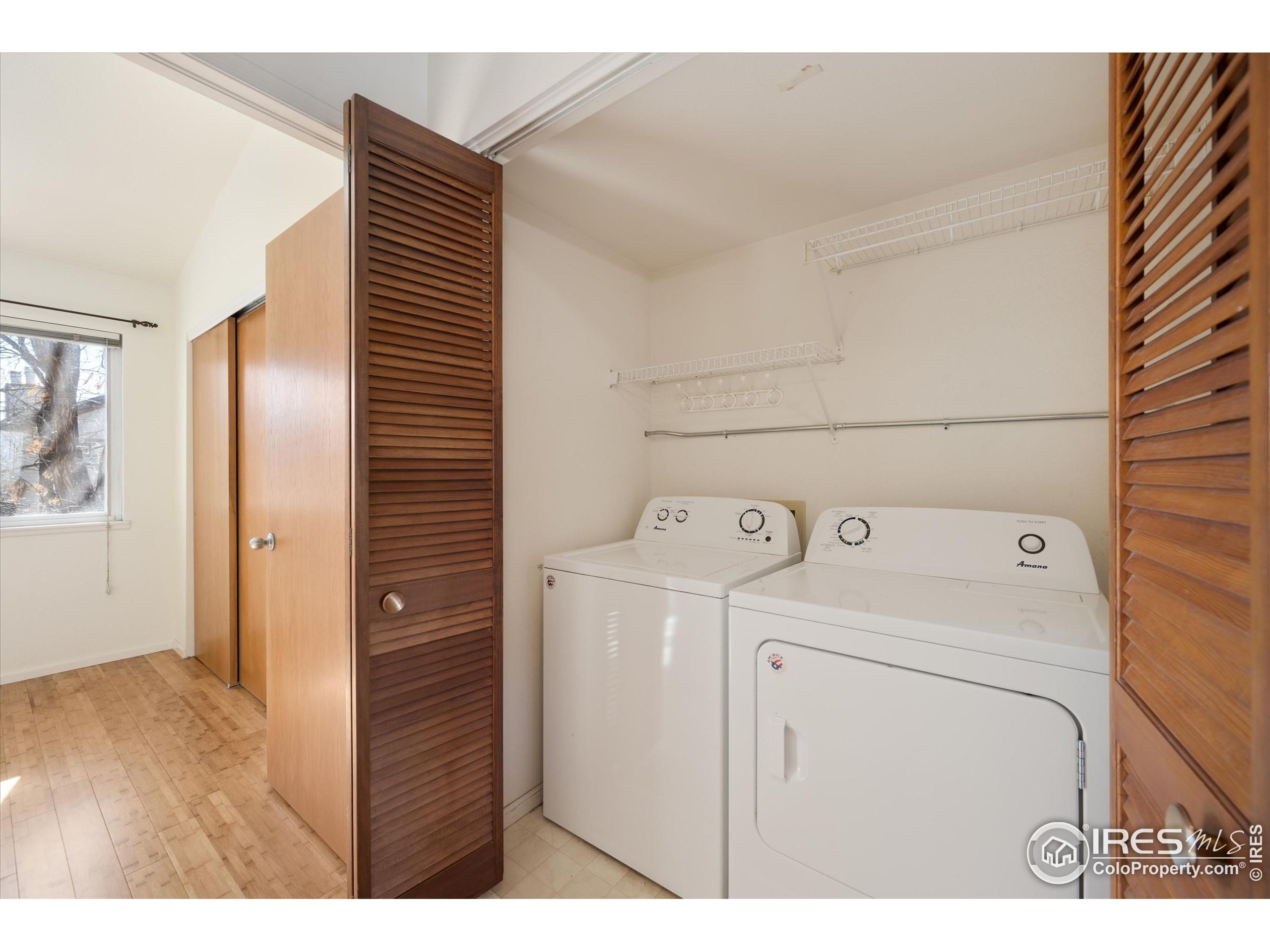 2960 West Stuart Street, Unit 304 Fort Collins, CO 80526 - Photo 18 of 28 a view of storage and utility room with washer and dryer
