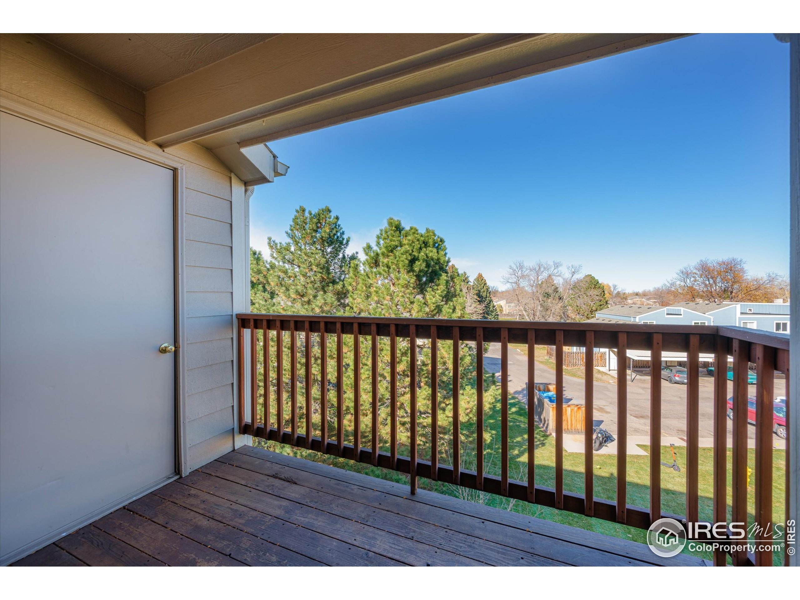 2960 West Stuart Street, Unit 304 Fort Collins, CO 80526 - Photo 20 of 28 a view of balcony with wooden floor