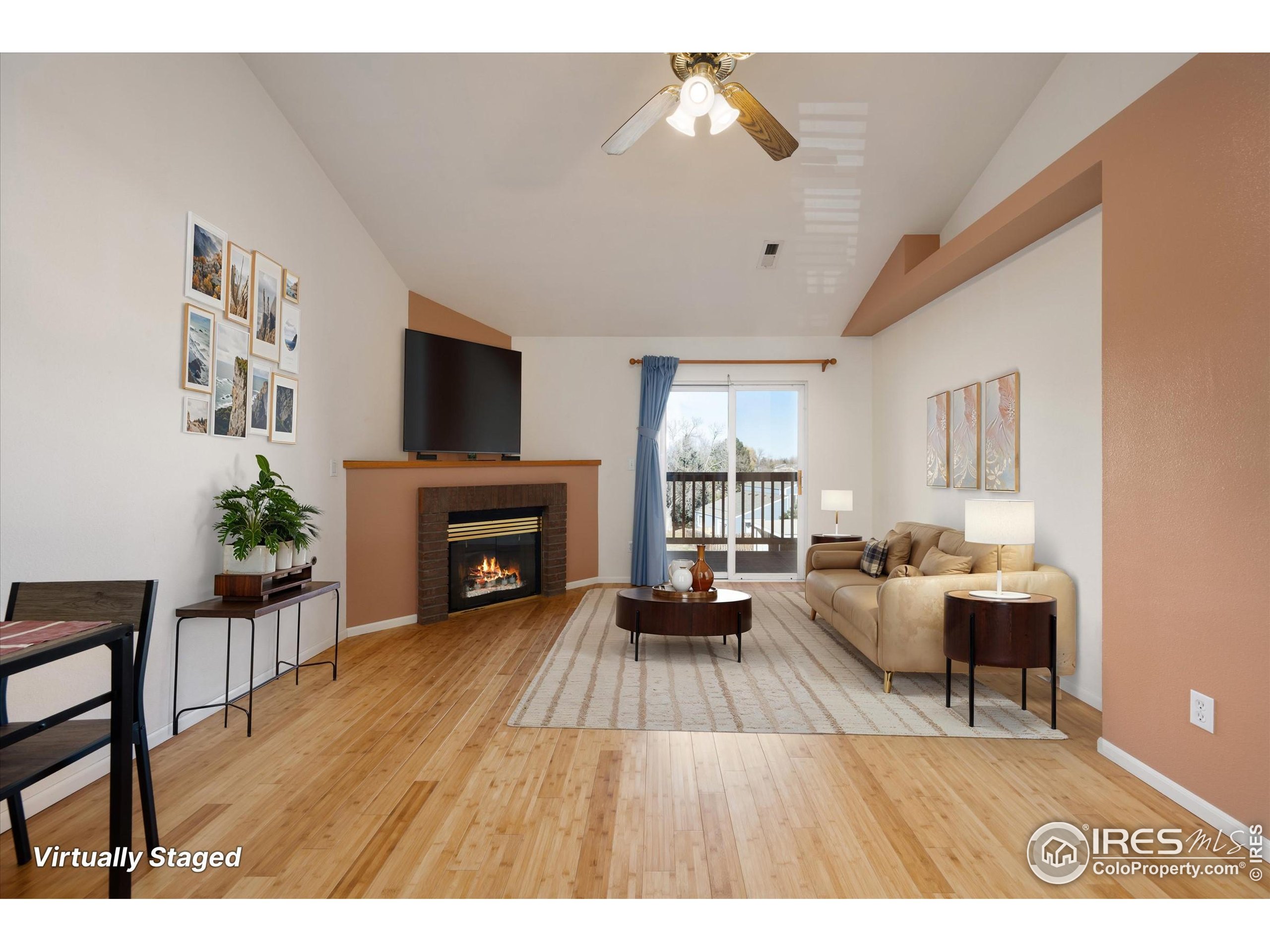 2960 West Stuart Street, Unit 304 Fort Collins, CO 80526 - Photo 3 of 28 a living room with furniture and a fireplace