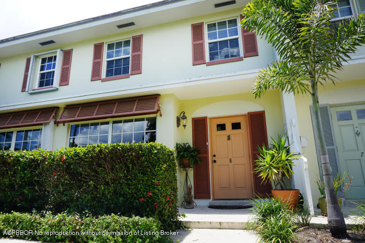 6590 North Ocean Boulevard, Unit 8 Ocean Ridge, FL 33435 - Photo 1 of 24 a front view of a house with a yard