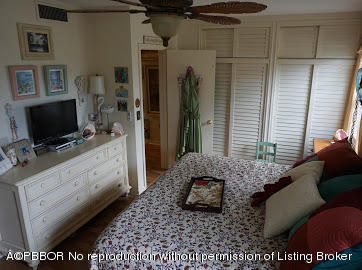 6590 North Ocean Boulevard, Unit 8 Ocean Ridge, FL 33435 - Photo 17 of 24 a living room with furniture and a flat screen tv