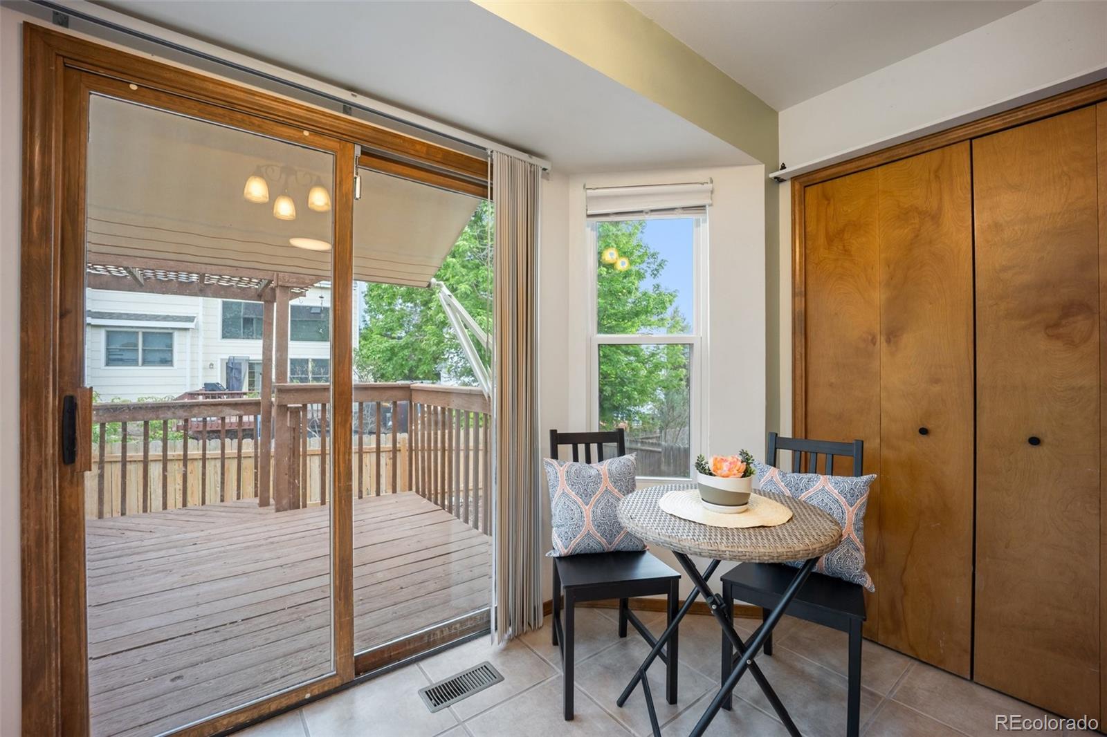 2035 Springcrest Road Colorado Springs, CO 80920 - Photo 13 of 39 a view of a dining room with furniture window and outside view