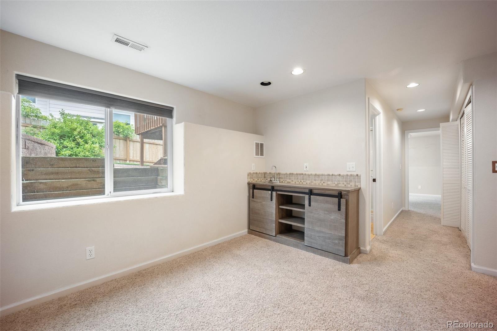 2035 Springcrest Road Colorado Springs, CO 80920 - Photo 33 of 39 a view of an empty room with a window