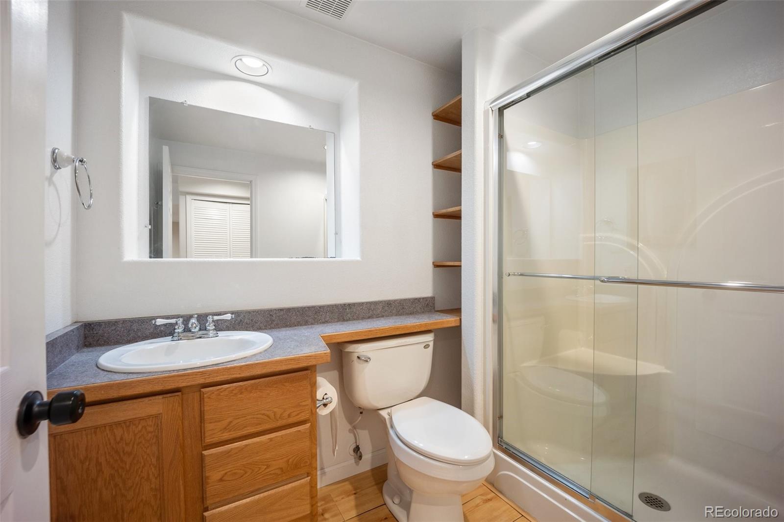 2035 Springcrest Road Colorado Springs, CO 80920 - Photo 34 of 39 a bathroom with a sink toilet and shower
