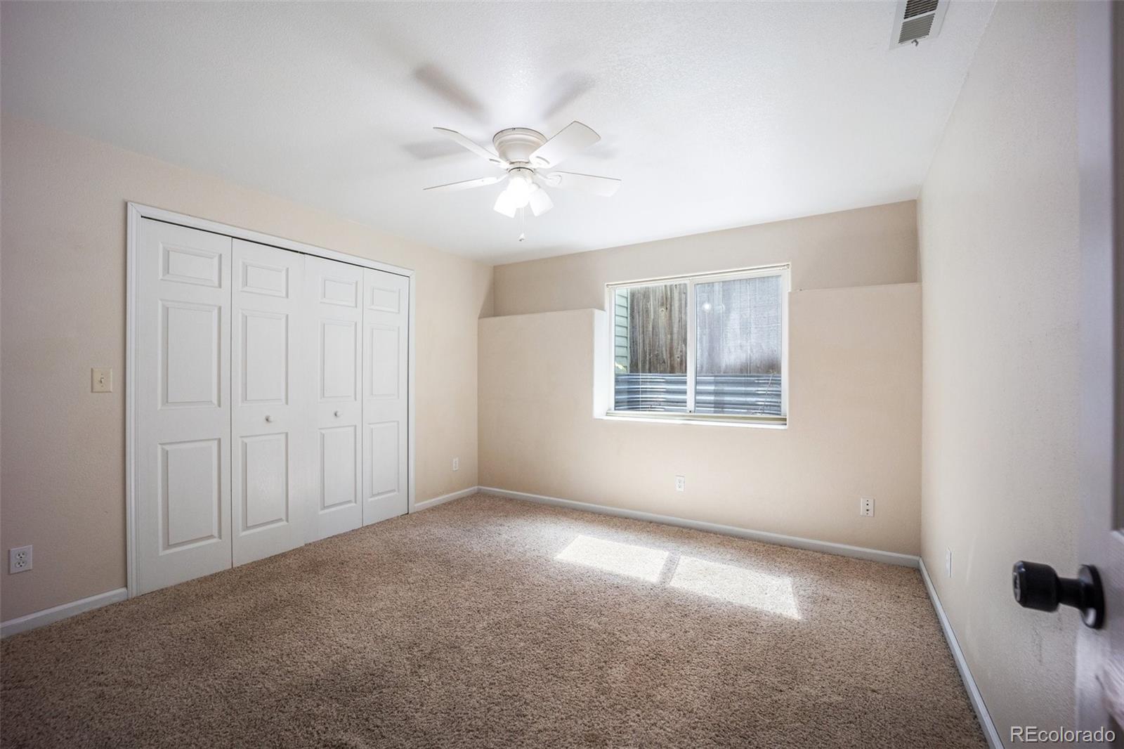 2035 Springcrest Road Colorado Springs, CO 80920 - Photo 38 of 39 a view of an empty room with a window