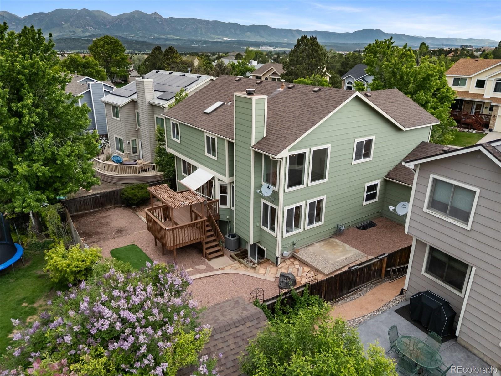 2035 Springcrest Road Colorado Springs, CO 80920 - Photo 5 of 39 an aerial view of a house with a garden