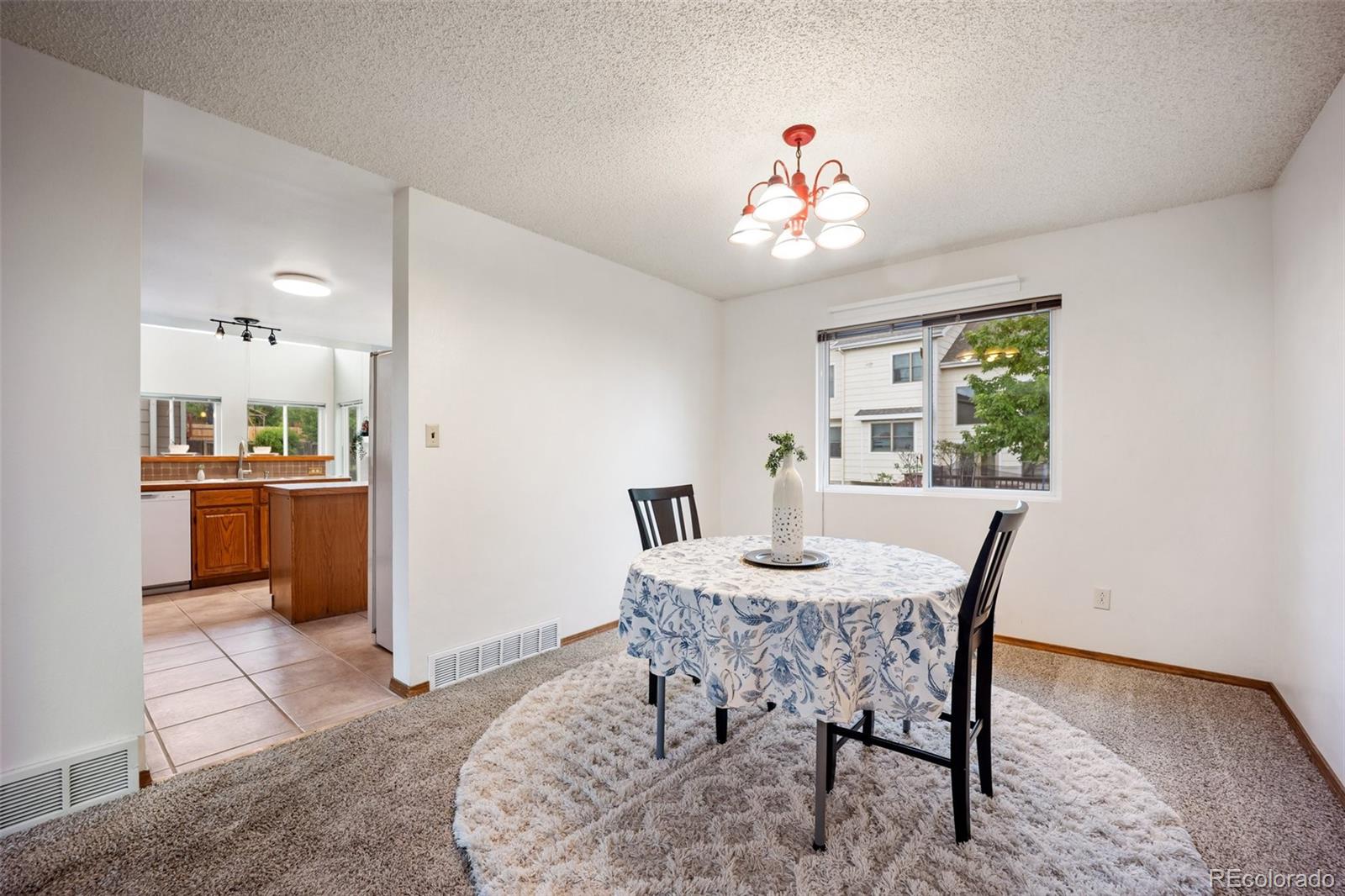 2035 Springcrest Road Colorado Springs, CO 80920 - Photo 10 of 39 a view of a dining room with furniture