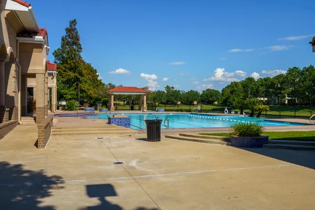 a swimming pool with yard