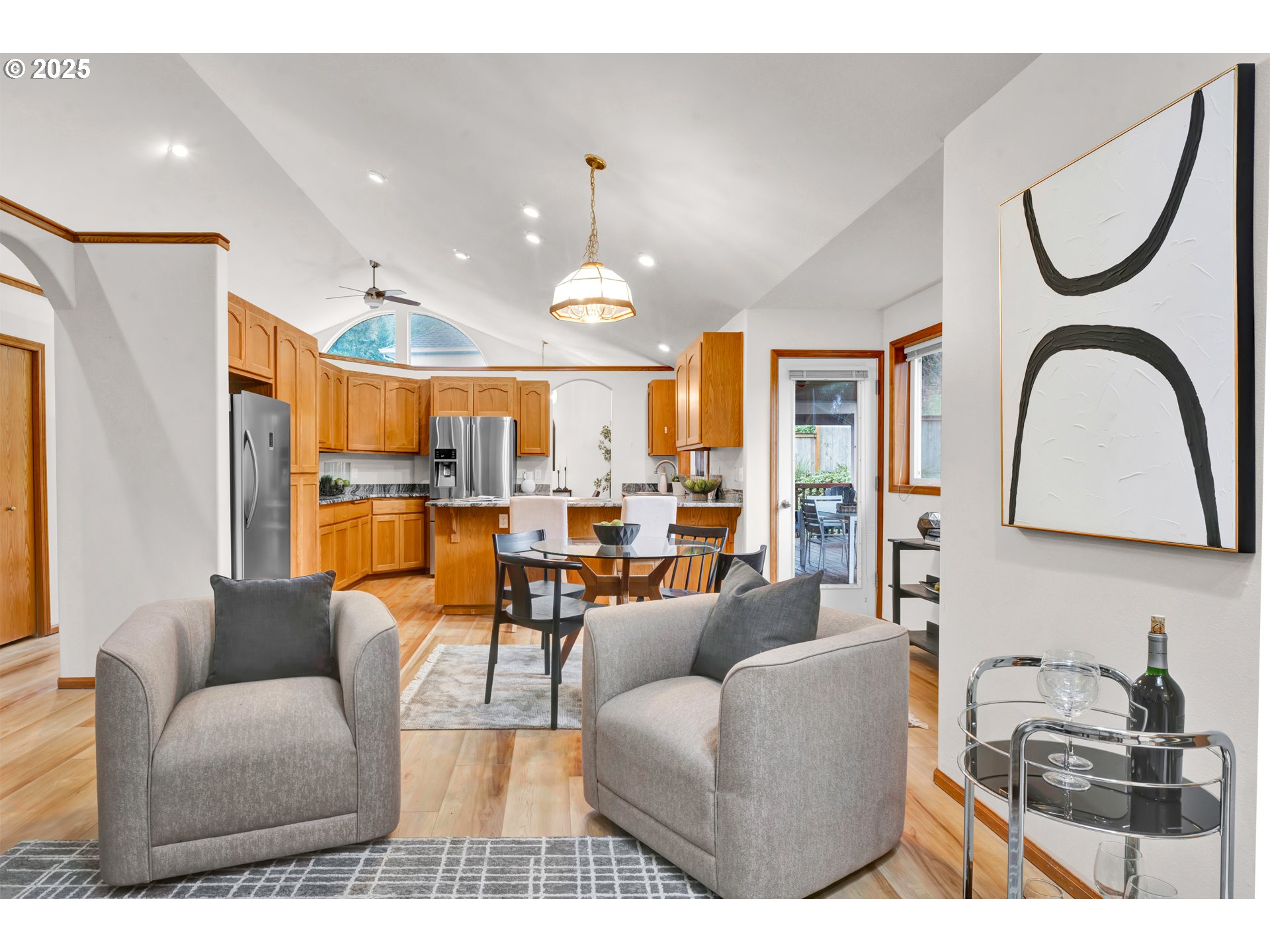 1002 South 69th Street Springfield, OR 97478 - Photo 15 of 44 a living room with furniture kitchen view and a chandelier