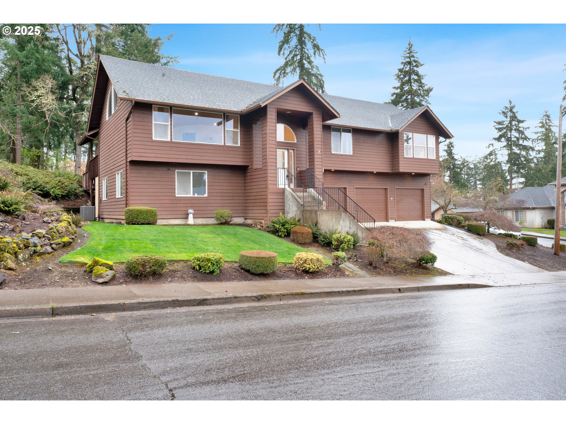 1002 South 69th Street Springfield, OR 97478 - Photo 2 of 44 a front view of a house with a yard and garage