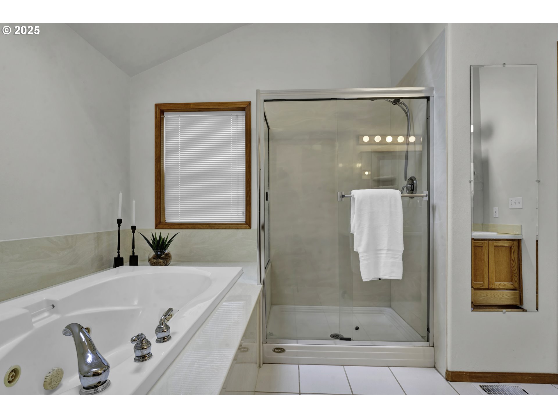 1002 South 69th Street Springfield, OR 97478 - Photo 24 of 44 a bathroom with a tub shower and sink