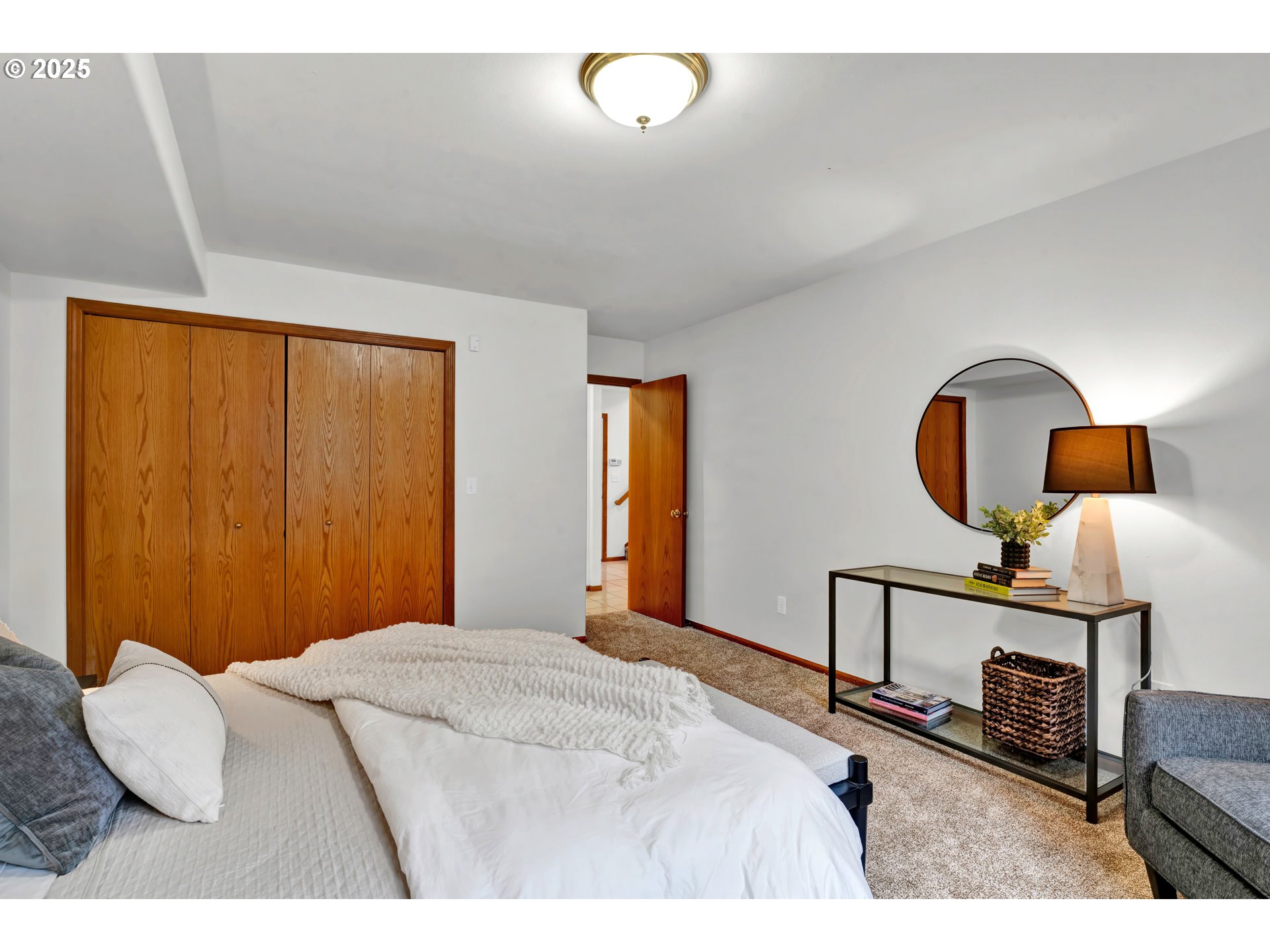 1002 South 69th Street Springfield, OR 97478 - Photo 29 of 44 a bedroom with a bed a mirror on dresser and a window