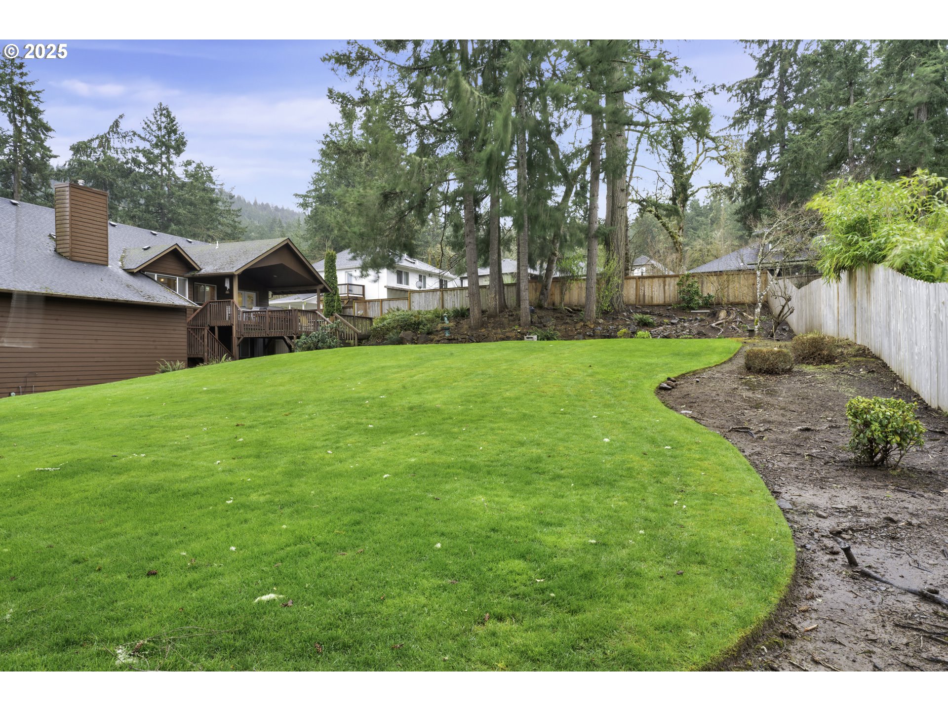 1002 South 69th Street Springfield, OR 97478 - Photo 38 of 44 a view of a yard with a house in the background
