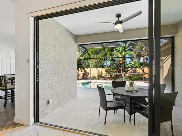 a dining room with furniture and a window
