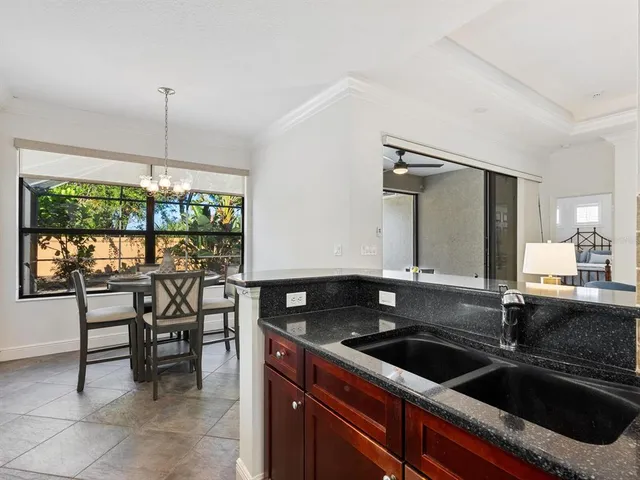 a kitchen that has a sink and a stove in it