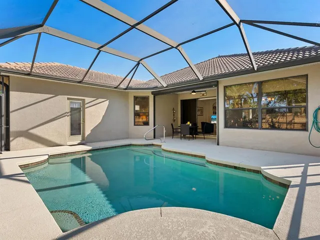 a view of a house with a porch and furniture